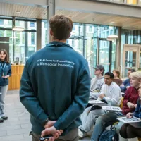 Two of our students presenting to the event attendees