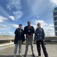 PhD researcher and her student shadows on the School of Informatics terrace