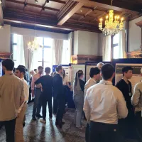Attendees in discussions during the poster session at the UKRI AI CDTs in Healthcare Conference 2025