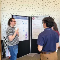 Our students gathered around their peer's poster