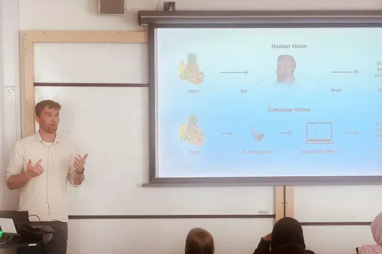 Jamie Davies presenting to a class of secondary school students