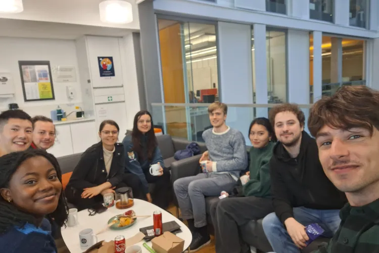 PhD researchers and their student shadows having lunch in the Informatics building