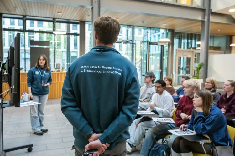 Two of our students presenting to the event attendees
