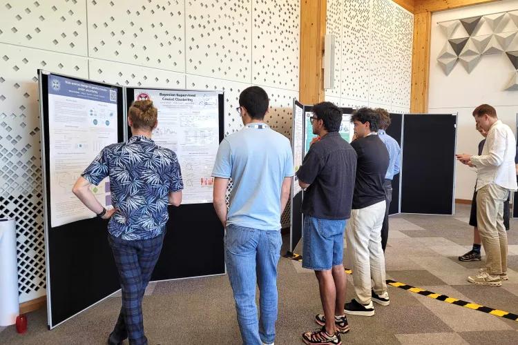 CDT students gathered around our students research posters