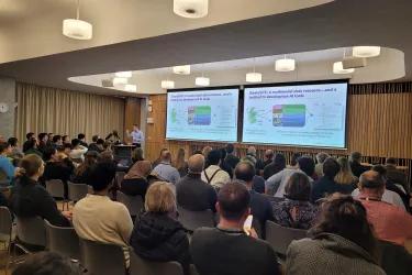 Audience watching a guest lecture at our industry event in March 2025