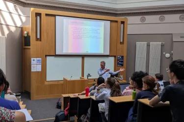 Mark van der Laan presenting in a lecture hall