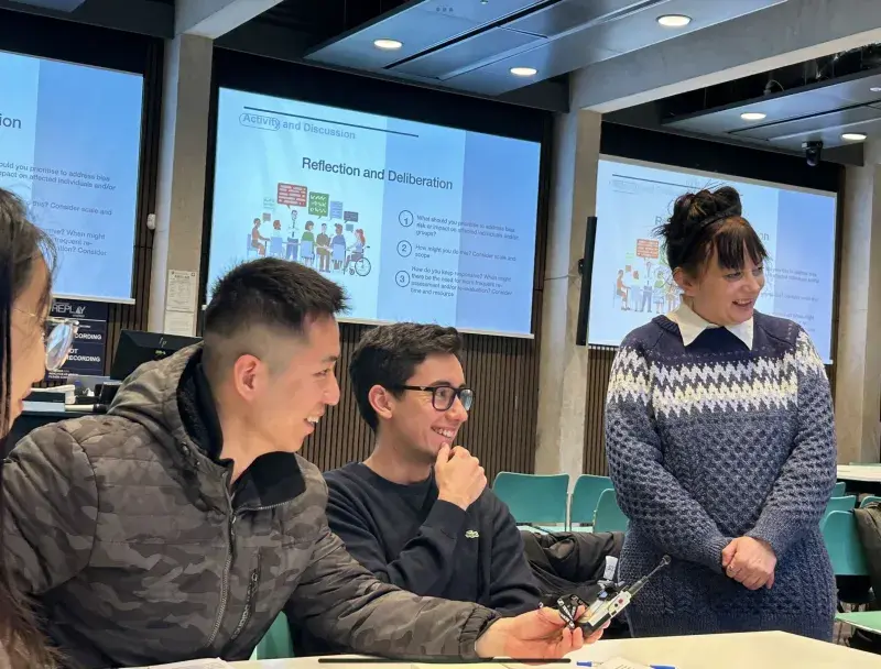 Students in discussion around a table