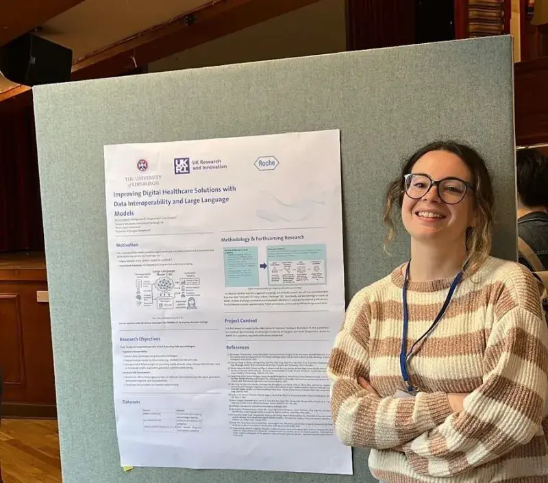 Elisa stood in front of her posterboard