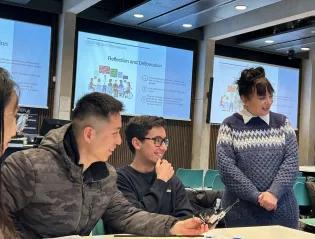Students in discussion around a table