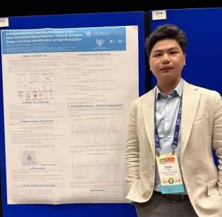 Zhijie stood in front of his posterboard