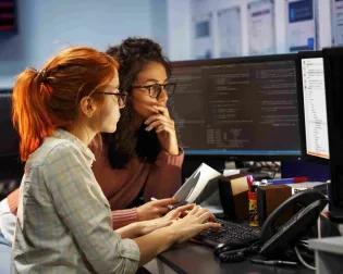 programmers looking at the screen