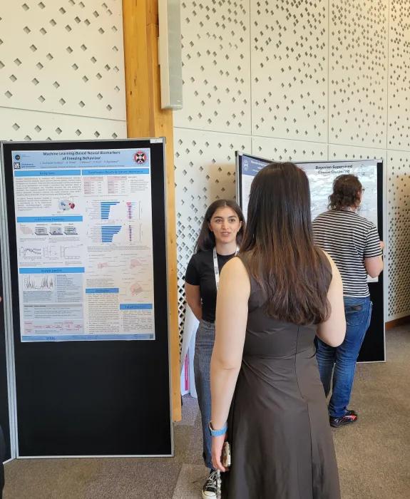 Our student Lachin presenting her poster